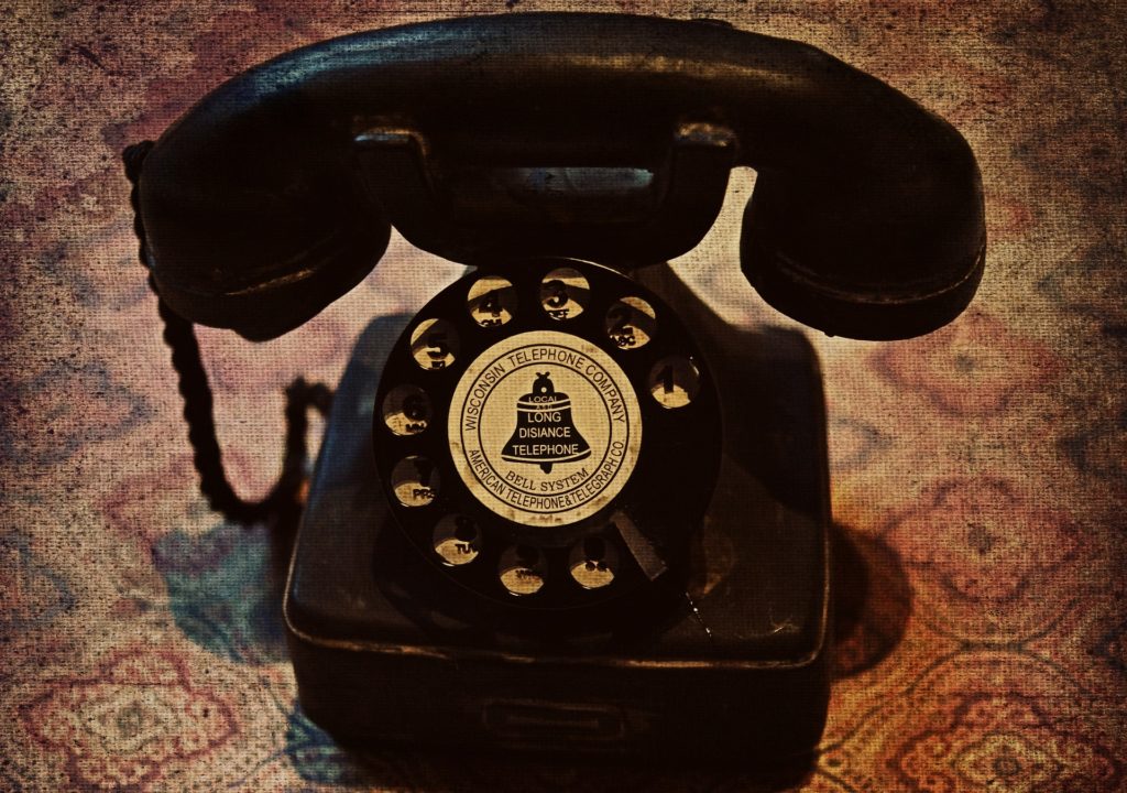 An old, black, rotary phone