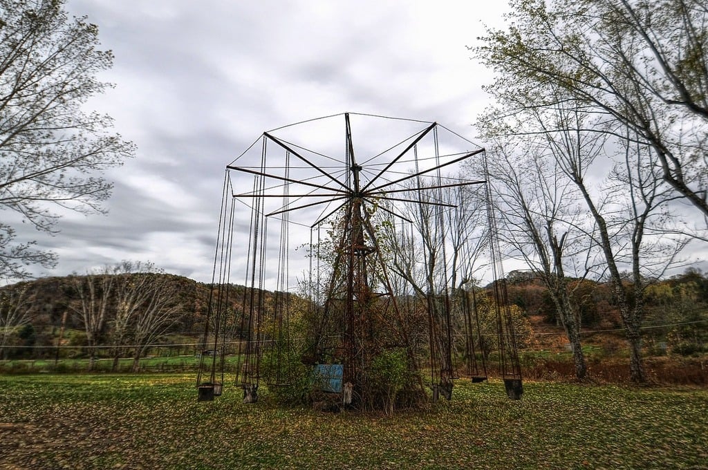 an abandoned swing ride at Lake Shawnee Amusement Park