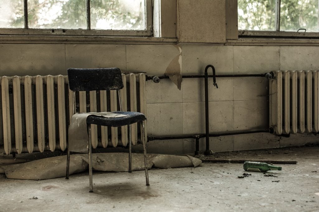 An abandoned chair in an abandoned room