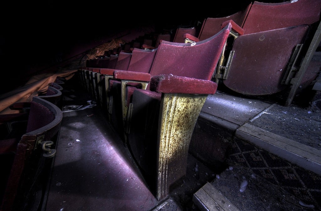 Abandoned red cinema seats
