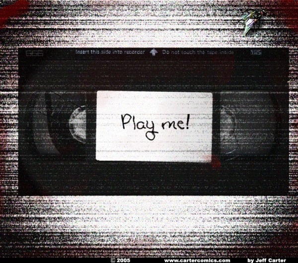 A VHS tape with "play me!" written on it