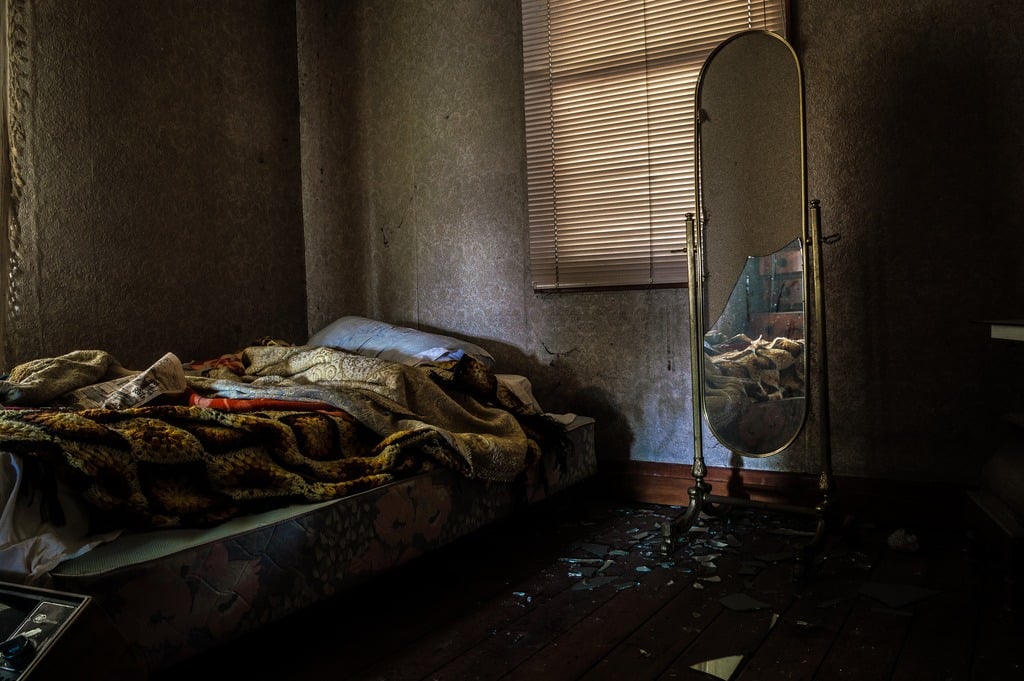 An abandoned bed in an abandoned room