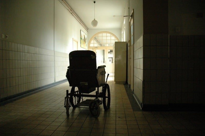 A wheelchair in a dim hallway