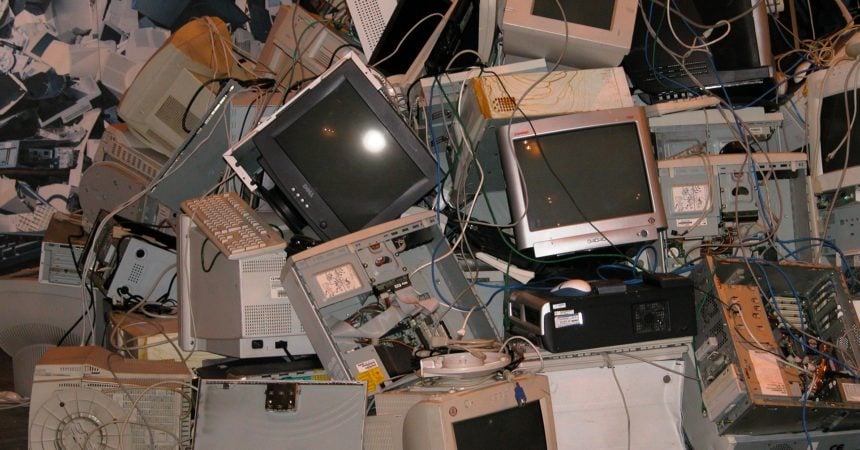 A pile of old computer monitors