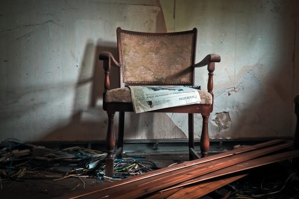 An old chair in an abandoned room