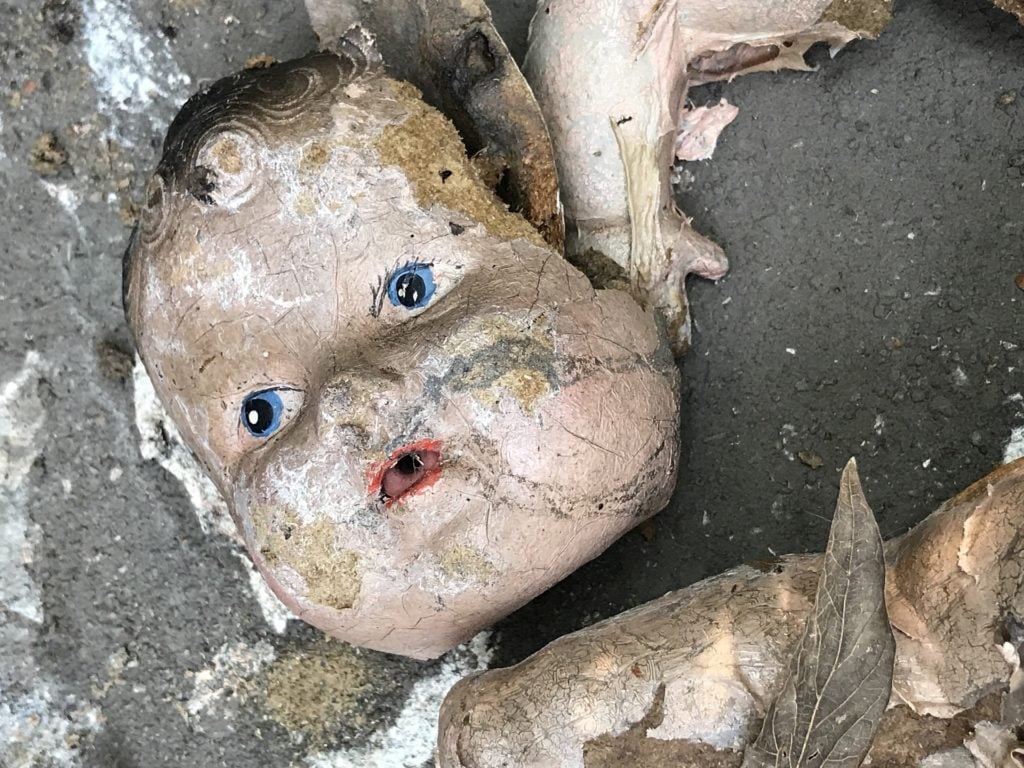 A broken baby doll face