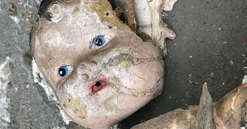 A broken baby doll face