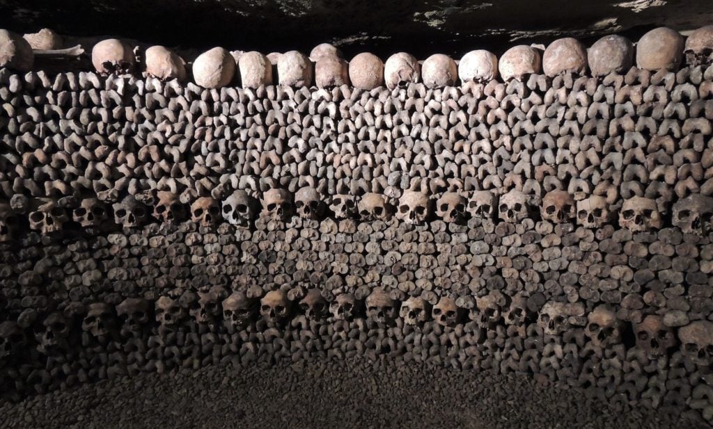 A wall of skulls and bones in the Paris Catacombs.