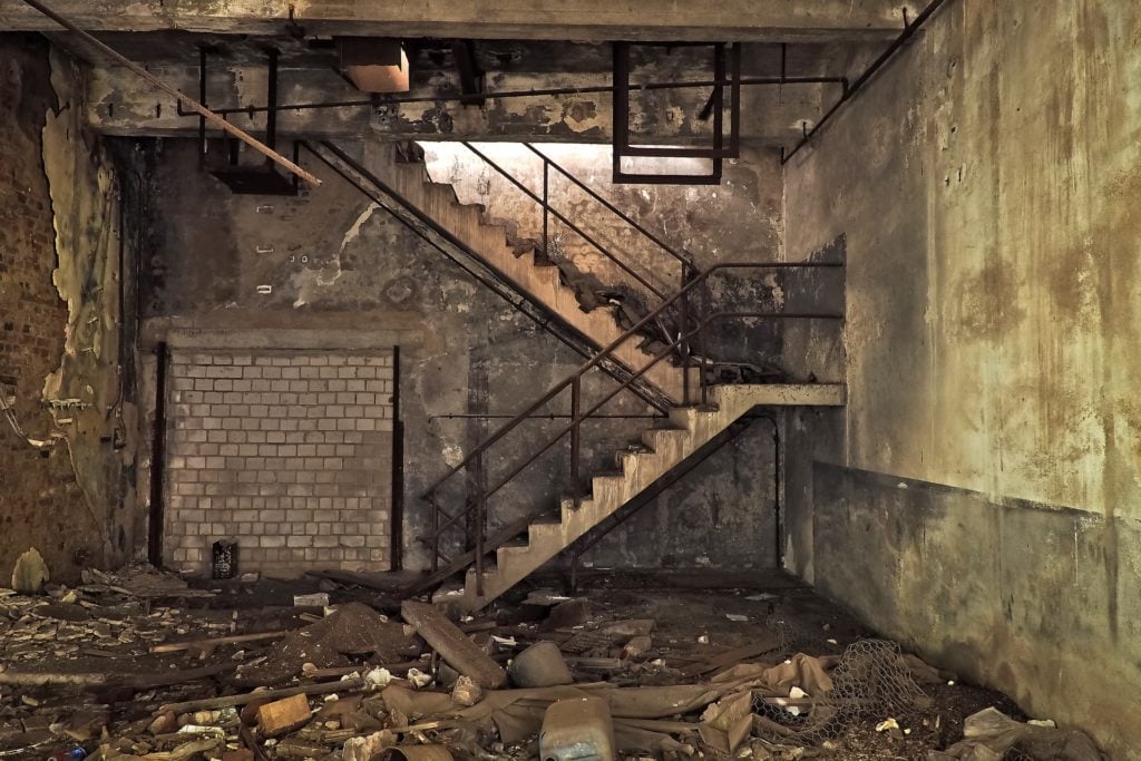 A staircase in an abandoned building