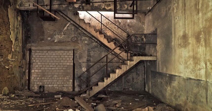A staircase in an abandoned building