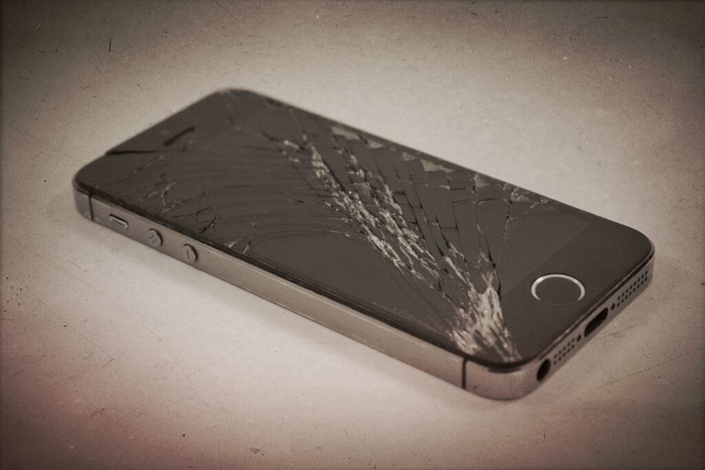 An iphone with a smashed screen