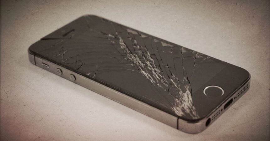 An iphone with a smashed screen