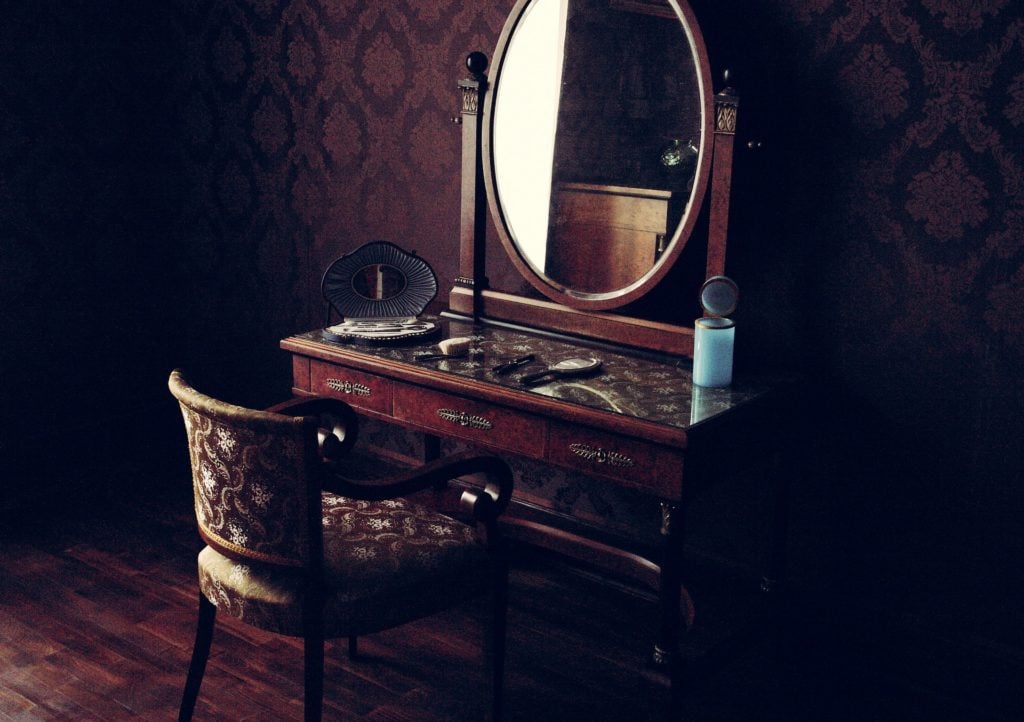 An ornate vanity in an old room