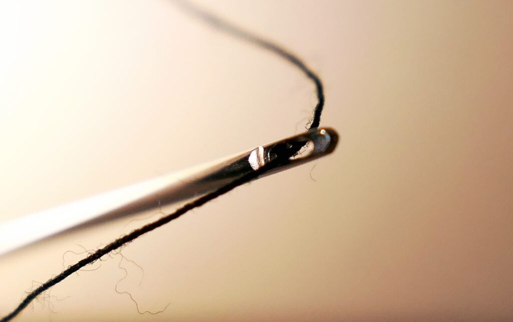 A threaded needle