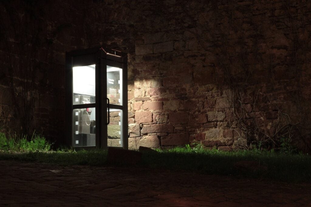 A phone booth at night