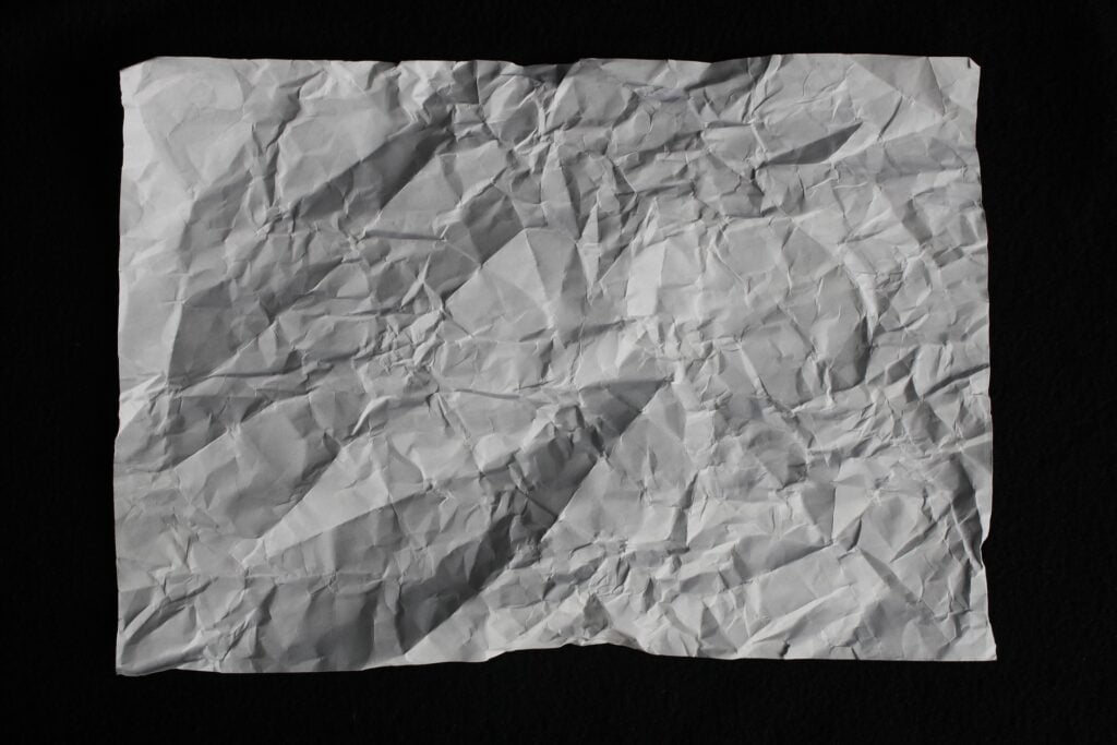 A piece of paper that's been crumpled up and then flattened out again