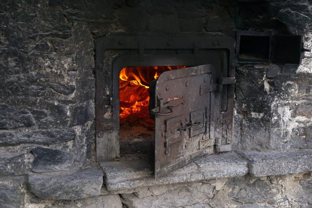 An open furnace, fire burning inside