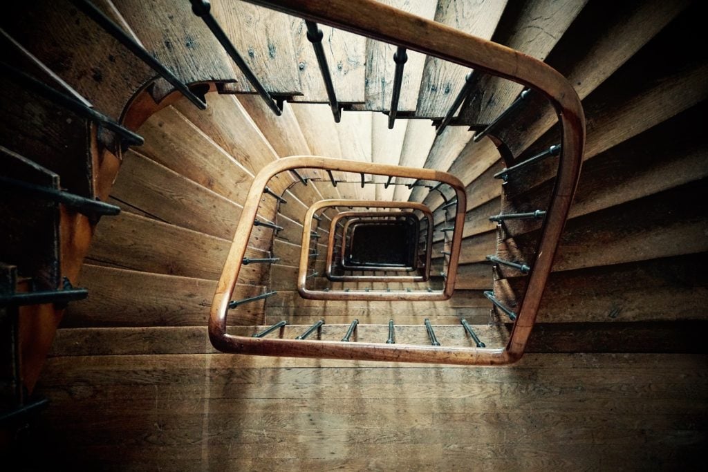 Looking down a spiral staircase from the top