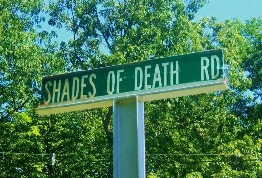 The street sign for Shades Of Death Rd