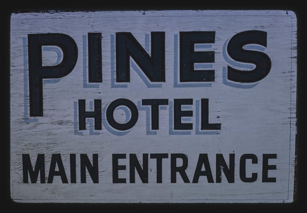 The Pines Hotel sign.