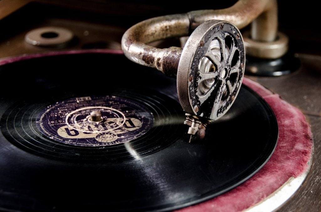 A close-up of a record on a phonograph