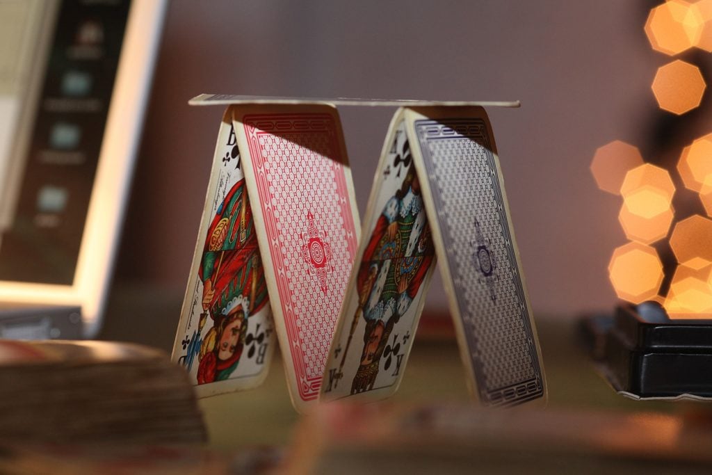 A house of cards made with vintage playing cards.