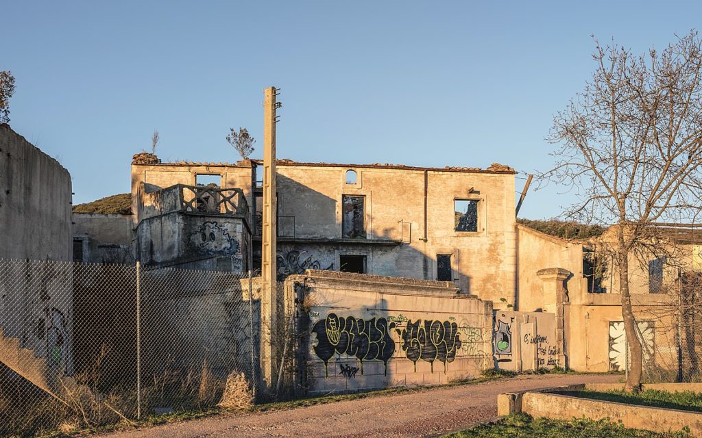 An abandoned building covered with graffiti in Celles, France.