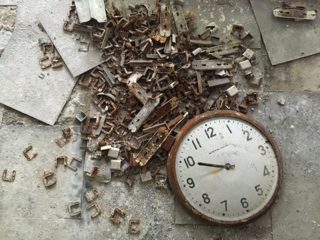 A clock face lying on the ground