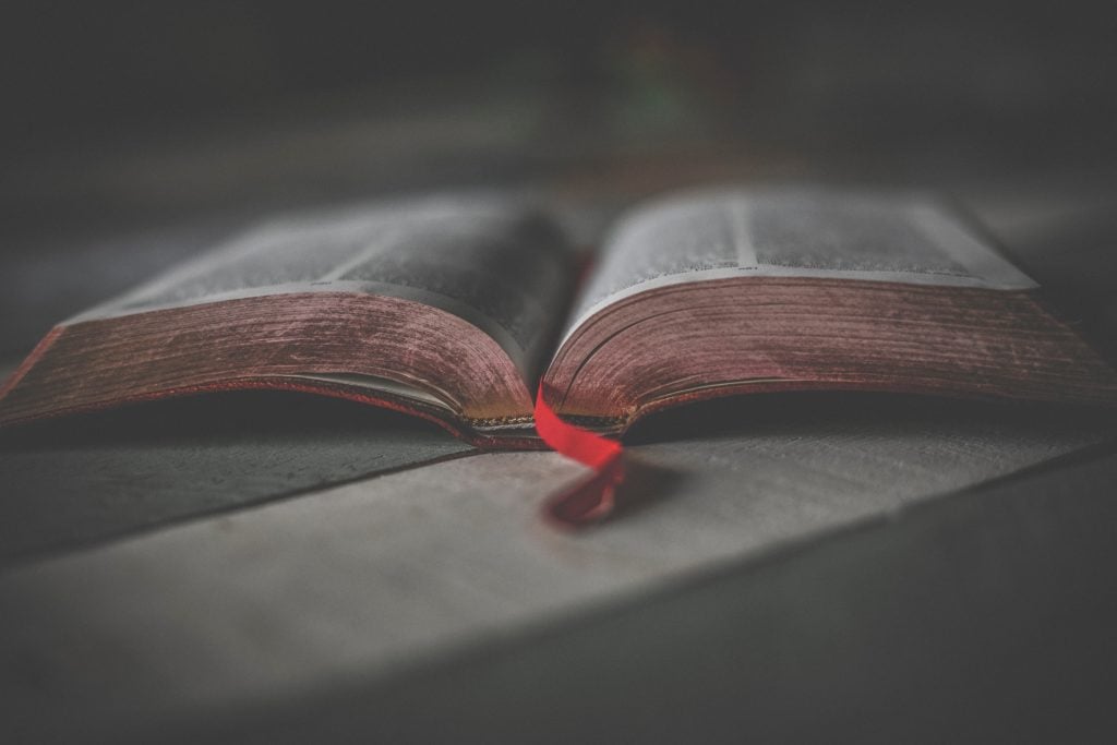 An open book with a red bookmark