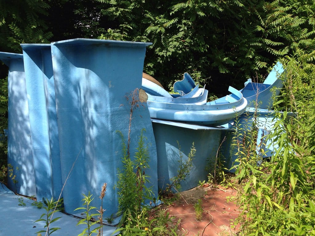 Large hunks of blue plastic, possibly from an old water slide, sitting abandoned outside at the former Blub water park in Berlin, 2013.