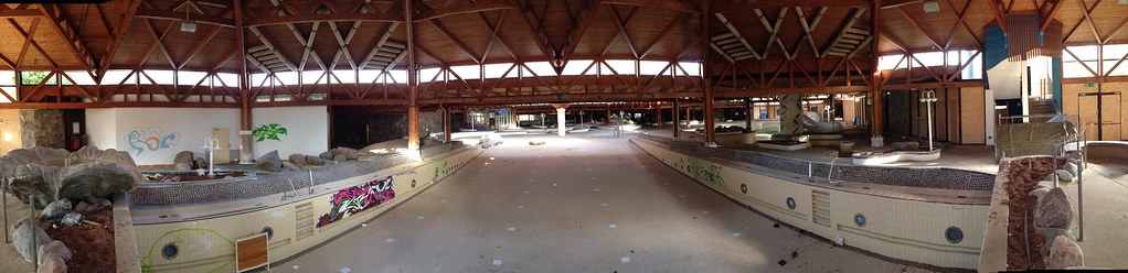 A panoramic shot of the entire empty, indoor pool at the abandoned Blub water park in Berlin, 2013.