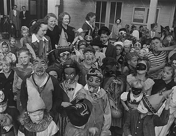 A black and white photograph of children in Halloween costumes, circa 1943.
