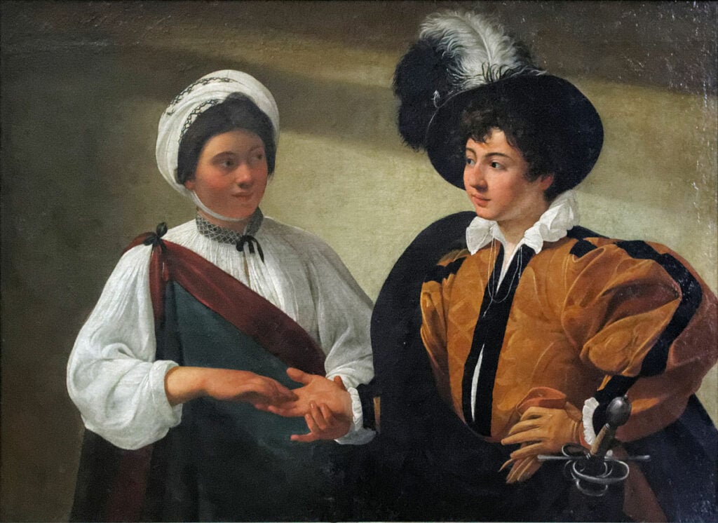 The painting "The Fortune Teller," painted by Caravaggio sometime between 1596 and 1597.