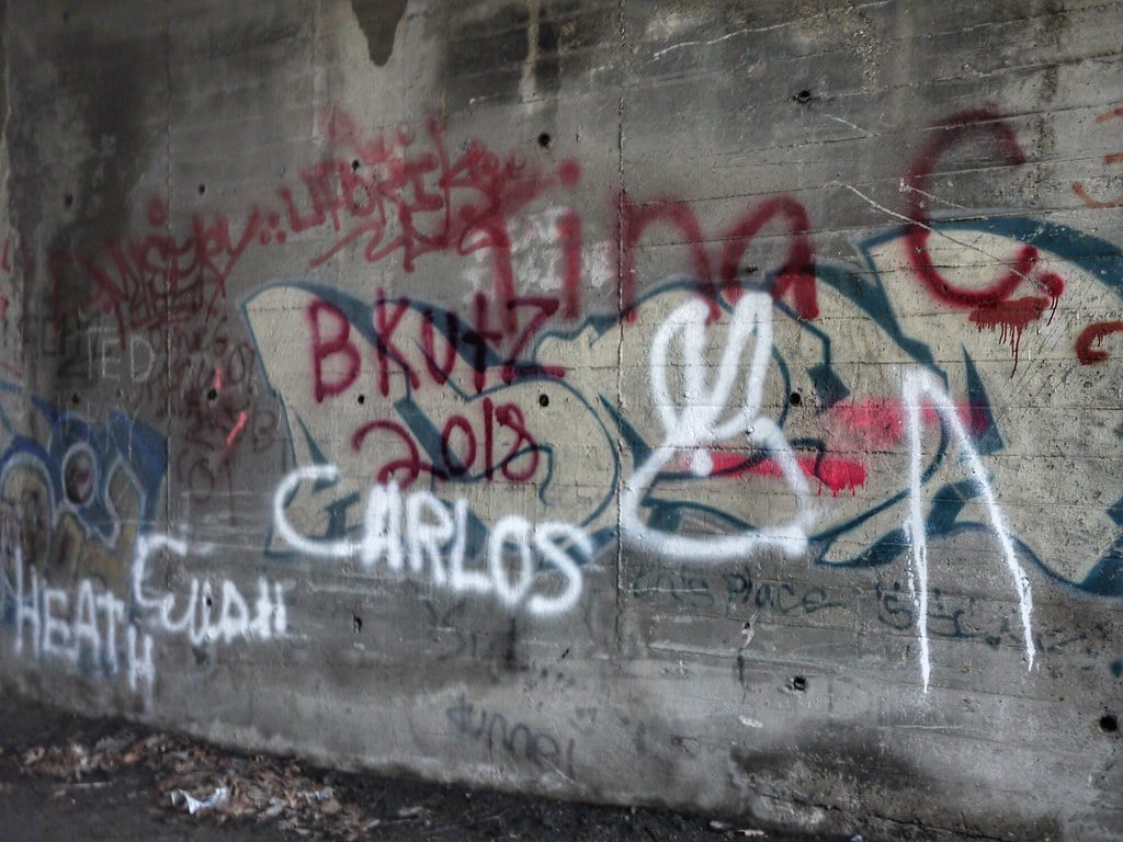 A graffiti-covered wall in a tunnel in the abandoned Cincinnati Subway.