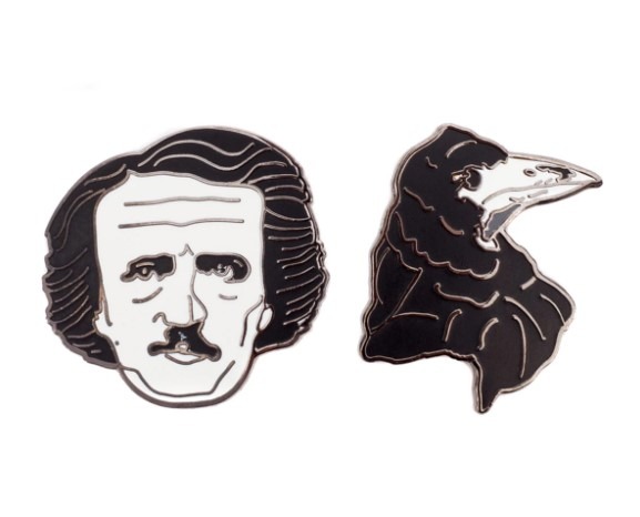 Two enamel pins: One of Edgar Allan Poe's face, one of a raven's head.