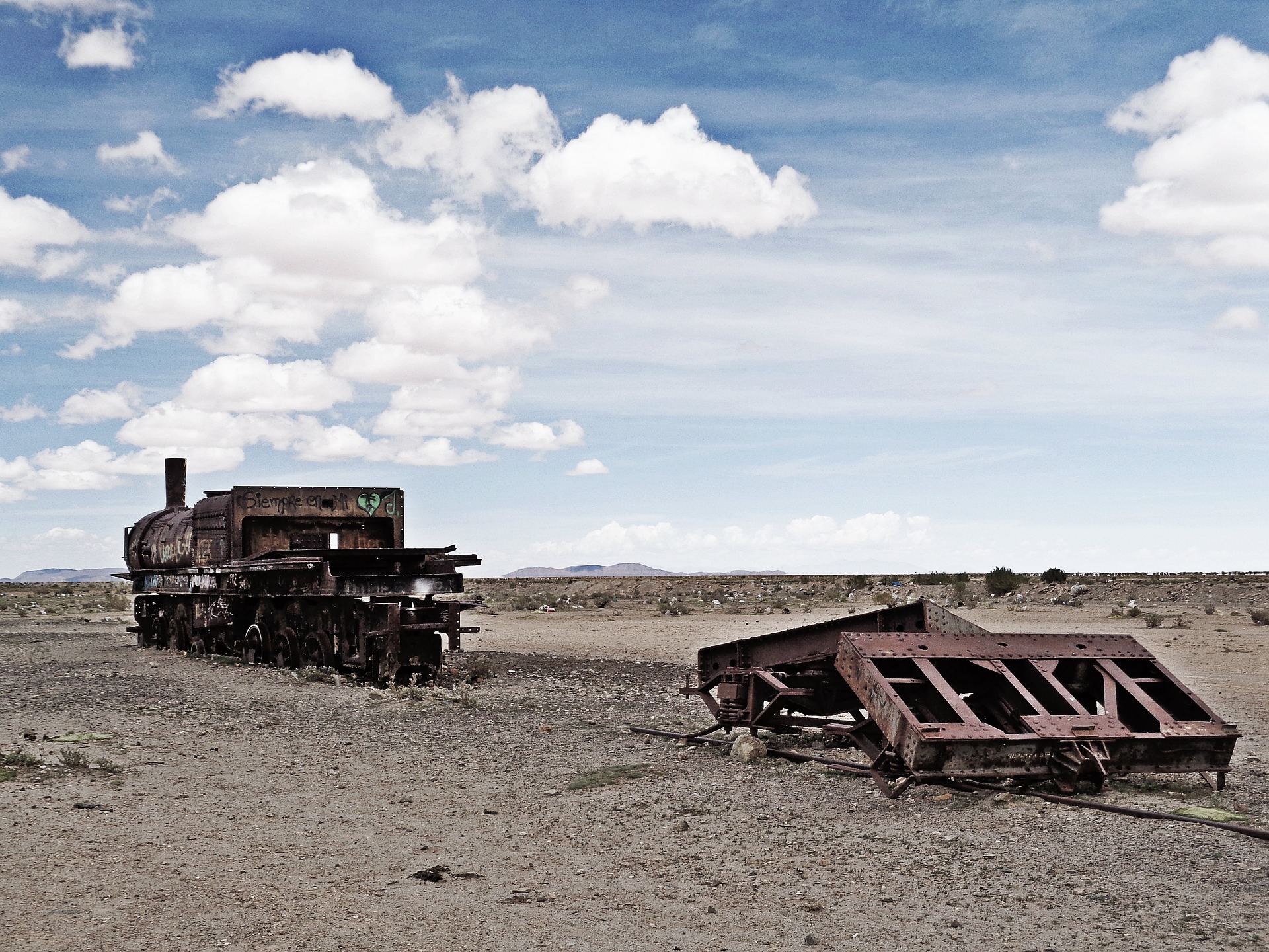 Abandoned train pieces in the desert.