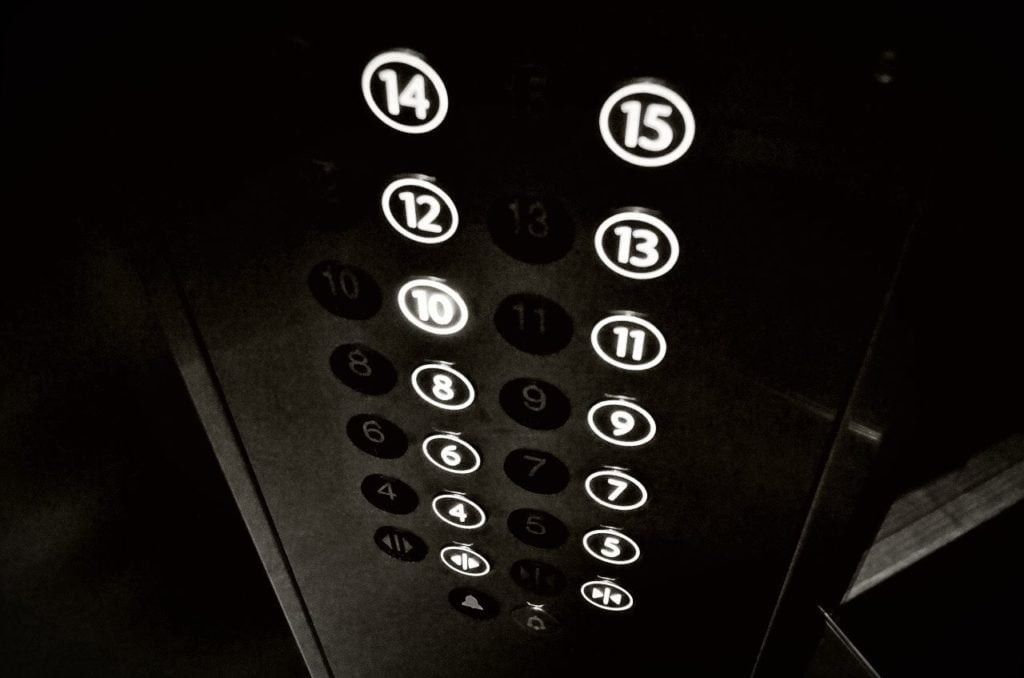 The control panel of an elevator, with buttons going up to 15