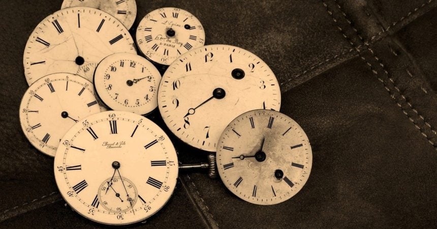 A pile of old clock faces