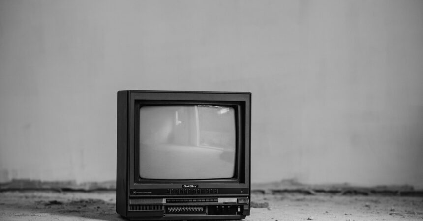 An old television sitting on the floor