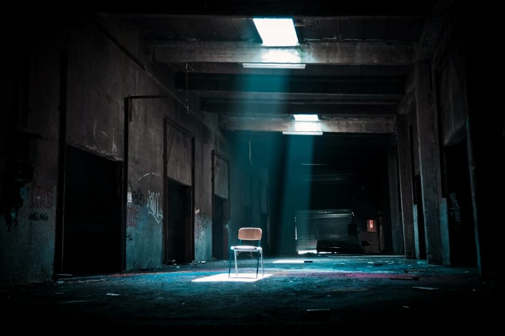 An abandoned chair in an empty room