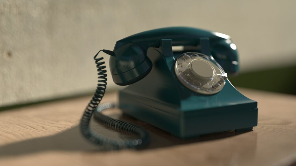 a green rotary telephone