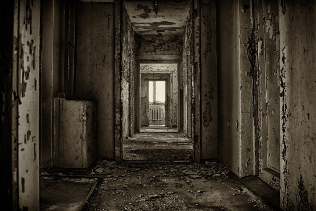 Looking down a hallway in an abandoned house 
