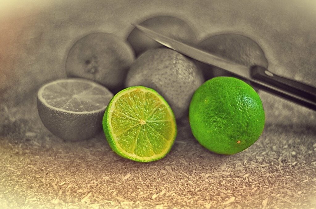 Limes on a table with a knife
