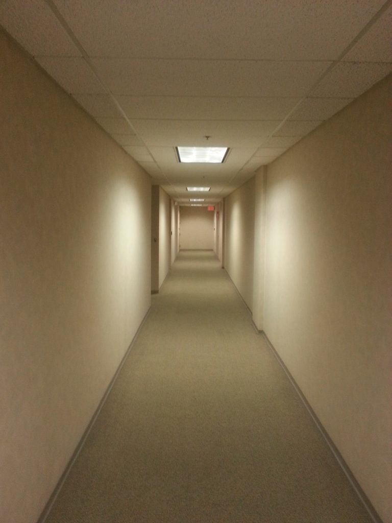 A long, monotonous office hallway