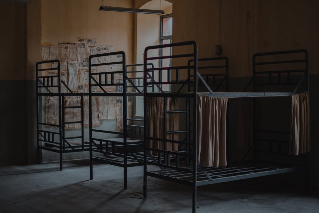 Metal bunk beds in an abandoned room
