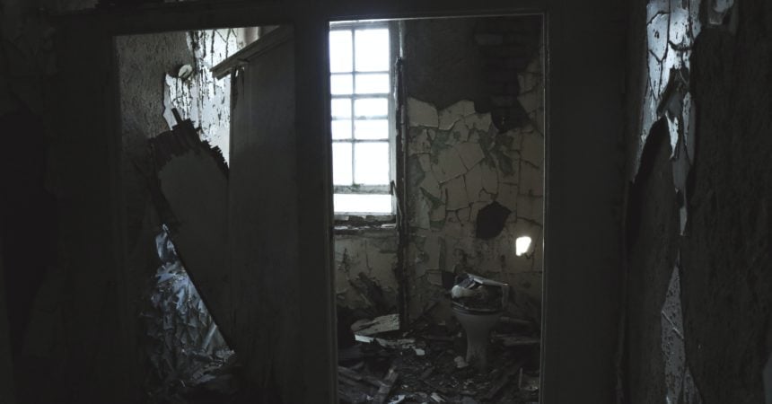 An abandoned bathroom in ruins