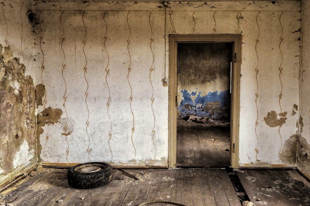 A decaying room in an abandoned house
