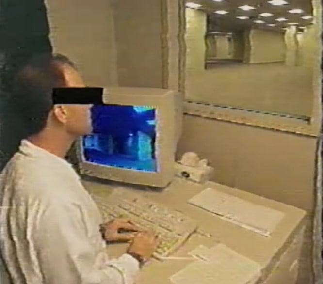 Photo of a scientist in an observation room in the Backrooms