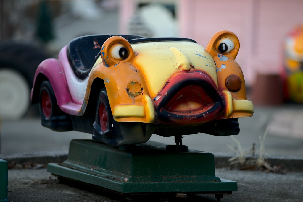 A ride-on car with a cartoon face at Yongma Land