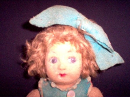 A close-up of Pupa the haunted doll's face